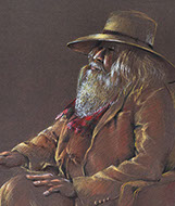 Portrait of seated man in a suit.